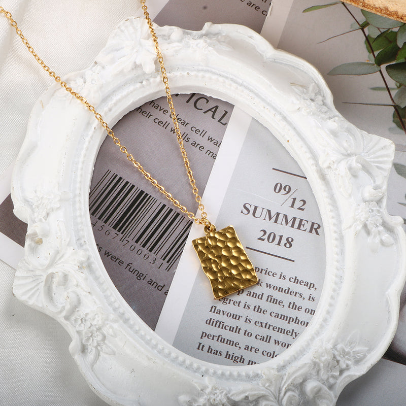 embossed tag necklace